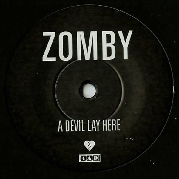 ZOMBY 'A DEVIL LAY HERE' 7" SINGLE